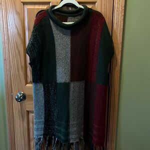 Net sweater poncho type tunic one size I’m a large and had lots of room